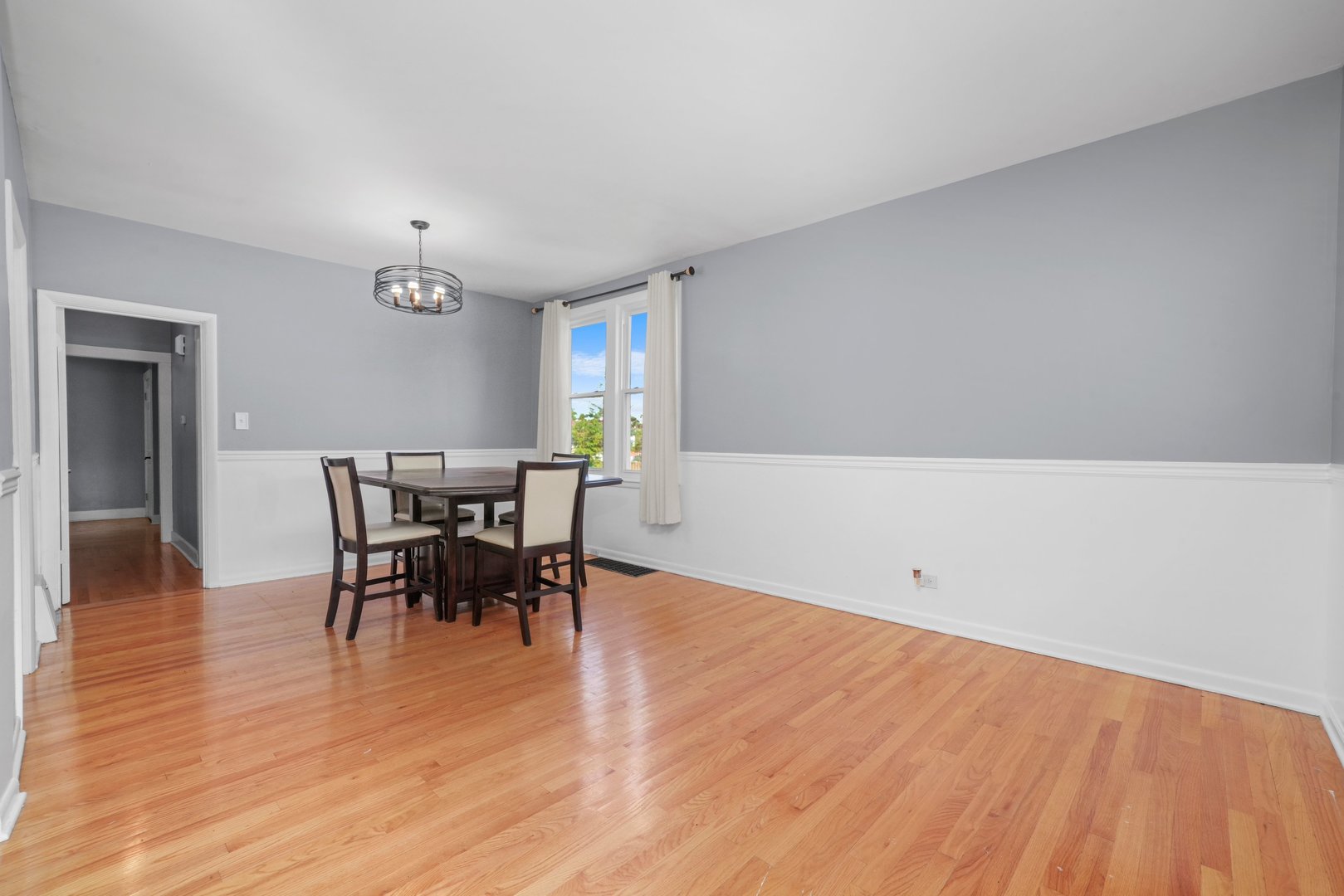 5648 Hawthorne Avenue Berkeley, IL 60163 - Photo 8 of 25 a view of a dining room with furniture and wooden floor
