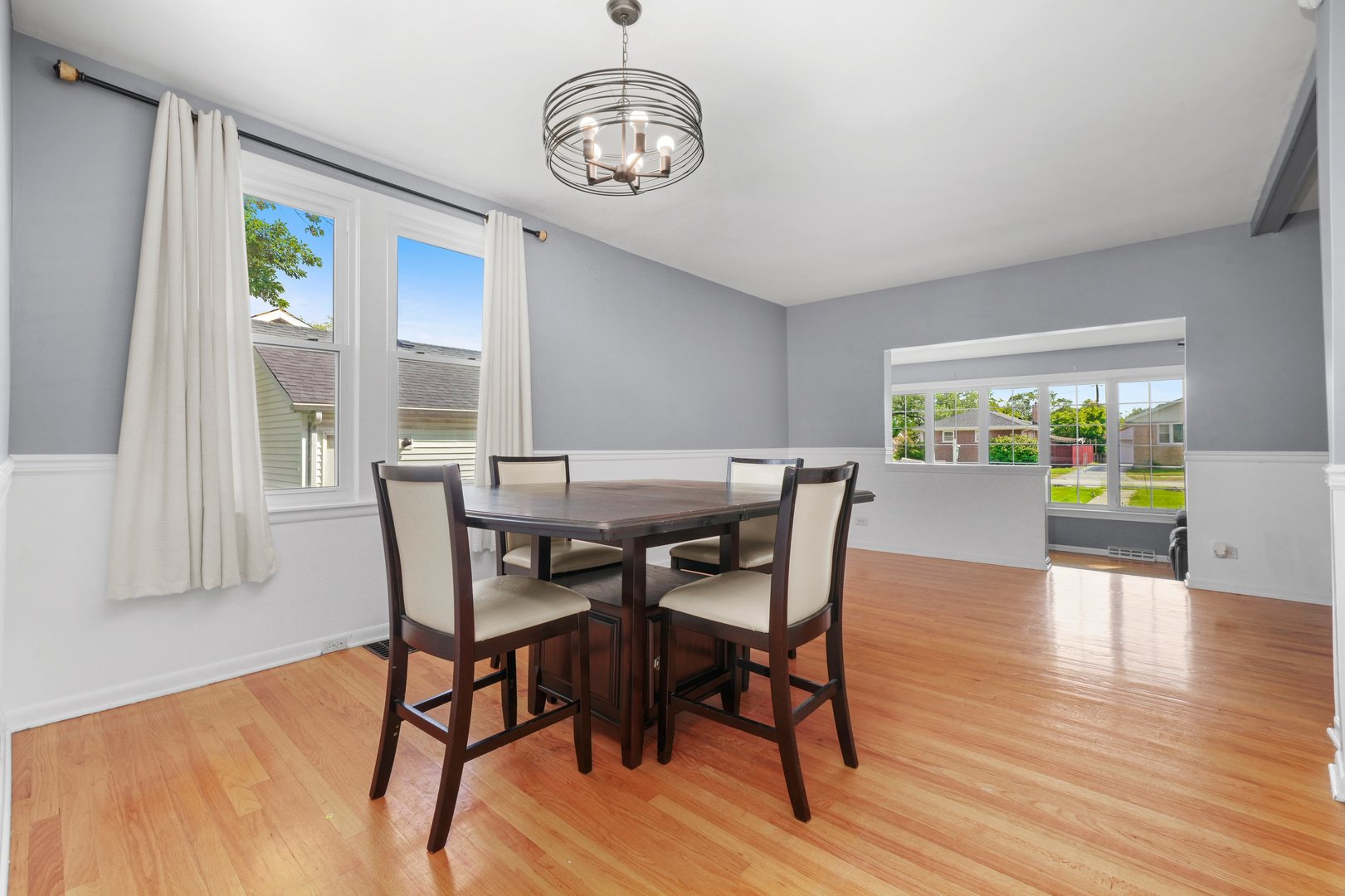 5648 Hawthorne Avenue Berkeley, IL 60163 - Photo 9 of 25 a view of a dining room with furniture window and wooden floor