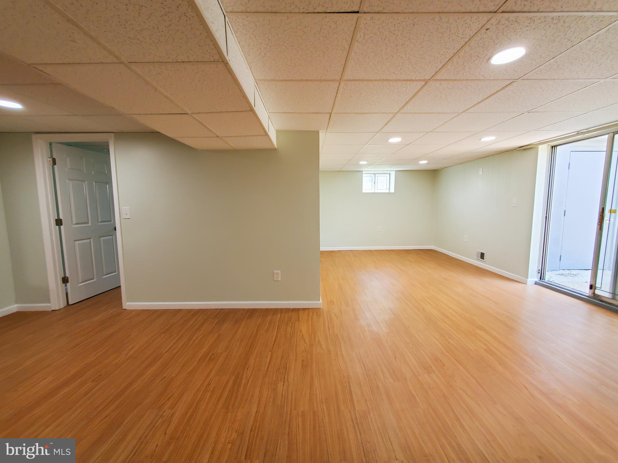 1512 Customs Road Baltimore, MD 21237 - Photo 25 of 43 an empty room with wooden floor