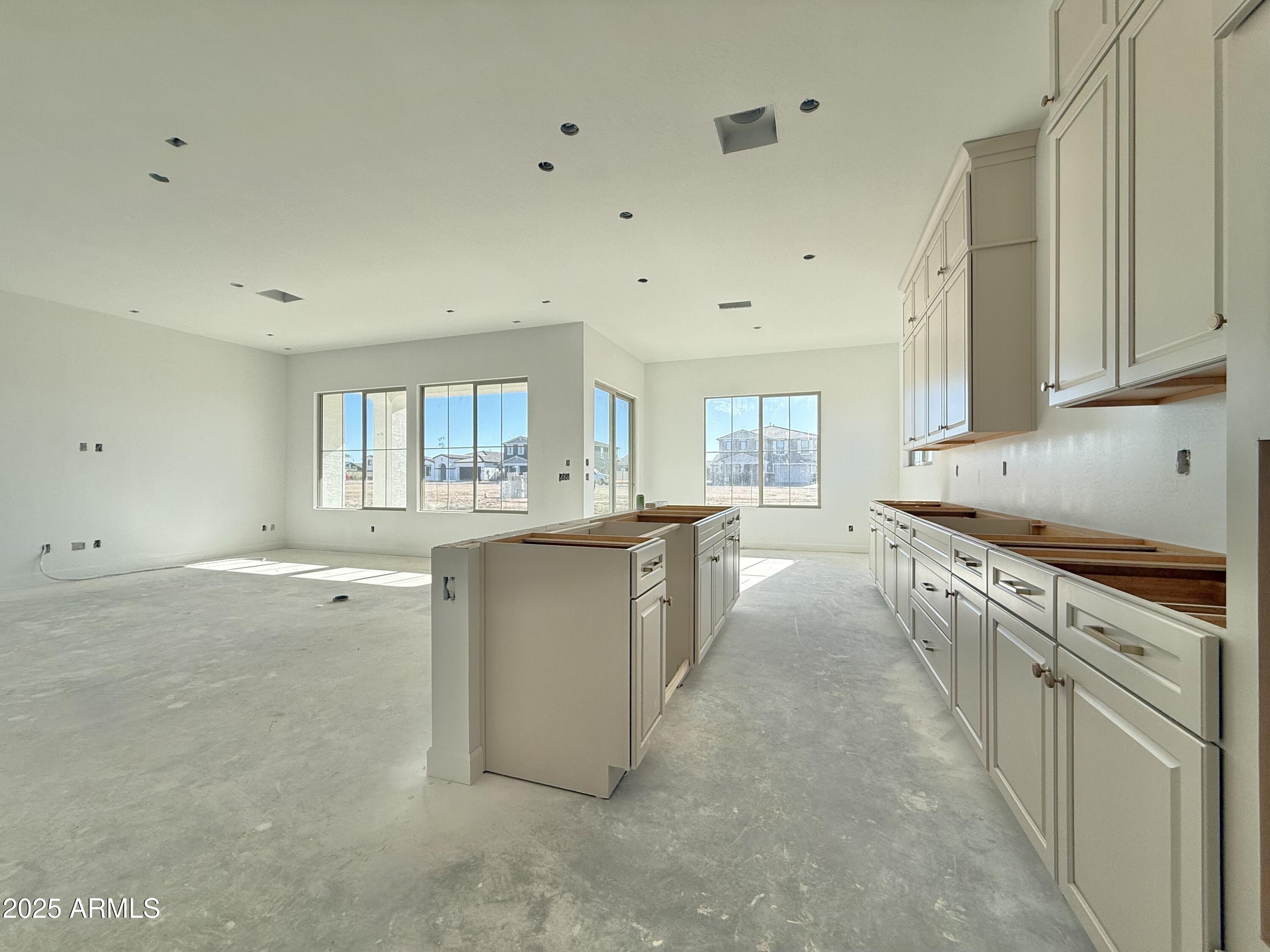 22757 East Saddle Way Queen Creek, AZ 85142 - Photo 11 of 34 a kitchen with cabinets and window