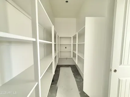 a view of gallery with wooden floor