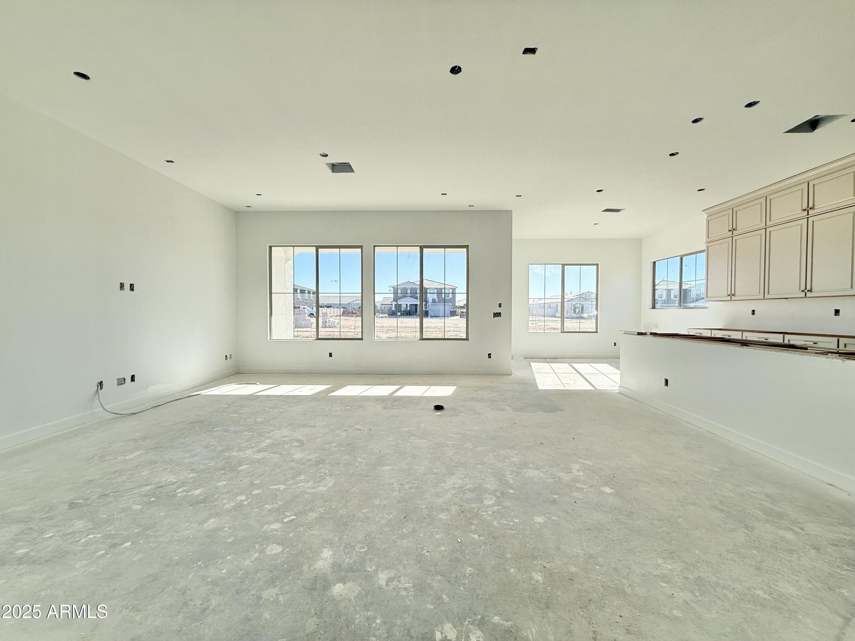 22757 East Saddle Way Queen Creek, AZ 85142 - Photo 18 of 34 a view of an empty room with a window