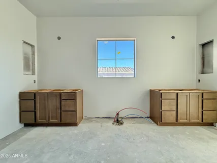 a view of an empty room with a cabinet