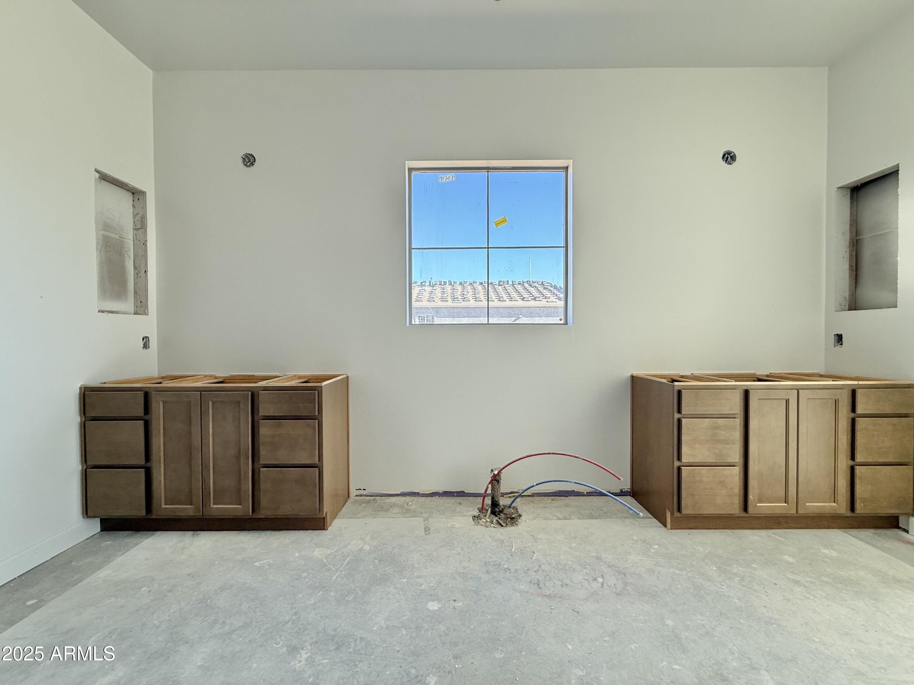 22757 East Saddle Way Queen Creek, AZ 85142 - Photo 22 of 34 a view of an empty room with a cabinet