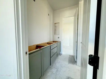 a kitchen with a refrigerator and a sink