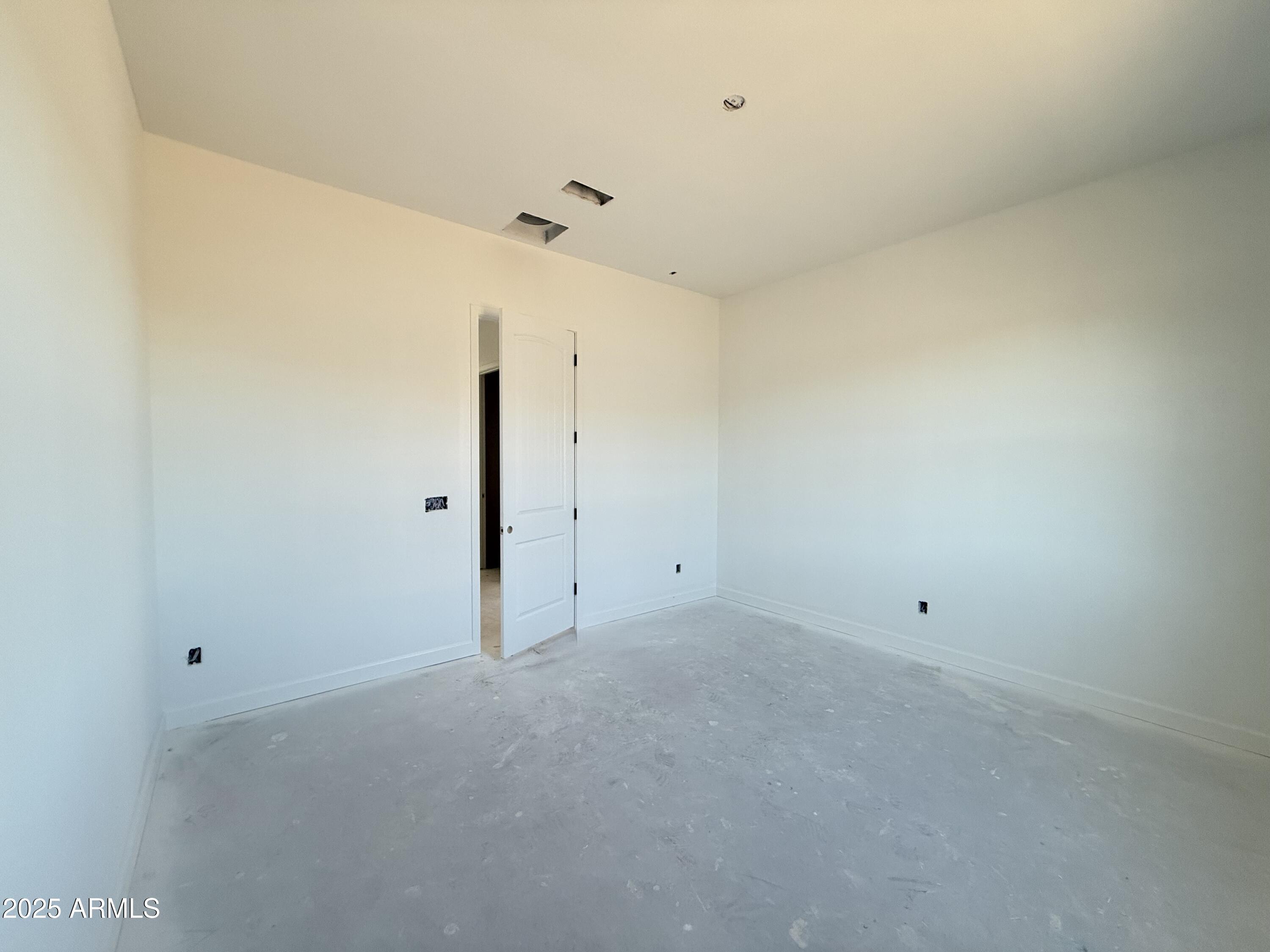 22757 East Saddle Way Queen Creek, AZ 85142 - Photo 8 of 34 a view of an empty room