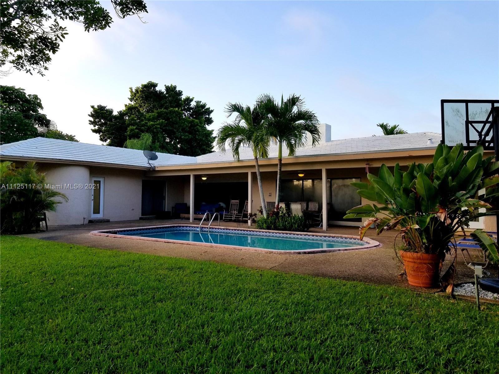 Emerald Hills Hollywood, FL 33021 - Photo 4 of 4 a front view of house with yard and outdoor seating