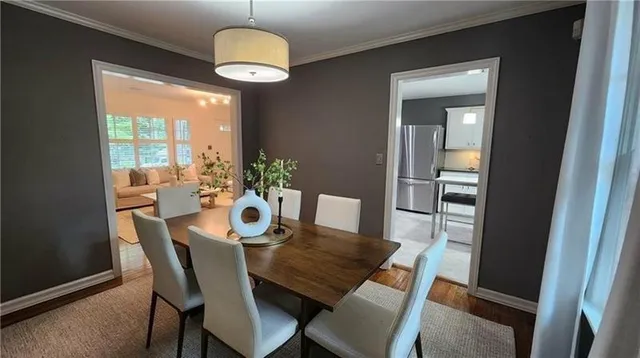 a view of a dining room with furniture window and outside view