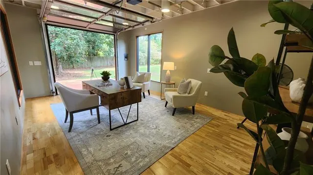 a living room with furniture and a large window