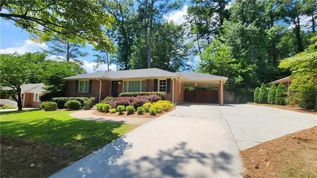 a front view of a house with a yard and porch