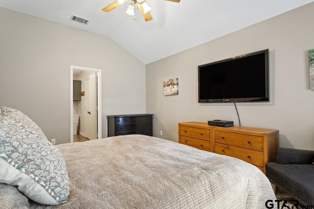 600 Frederick Circle Flint, TX 75762 - Photo 18 of 32 a bedroom with a bed and a flat screen tv