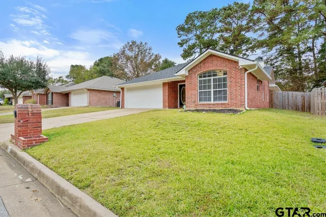 a front view of a house with yard