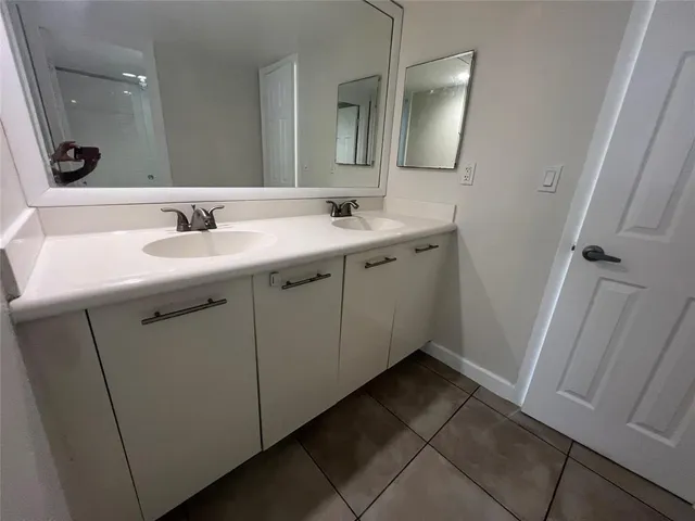 a view of a pathway with a tree