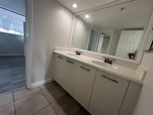 a view of beach with palm trees