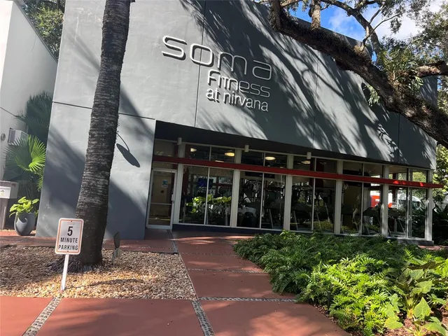 a view of a pathway of a house next to a lake
