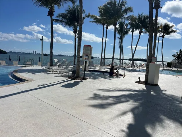 an empty room with closet and mirror