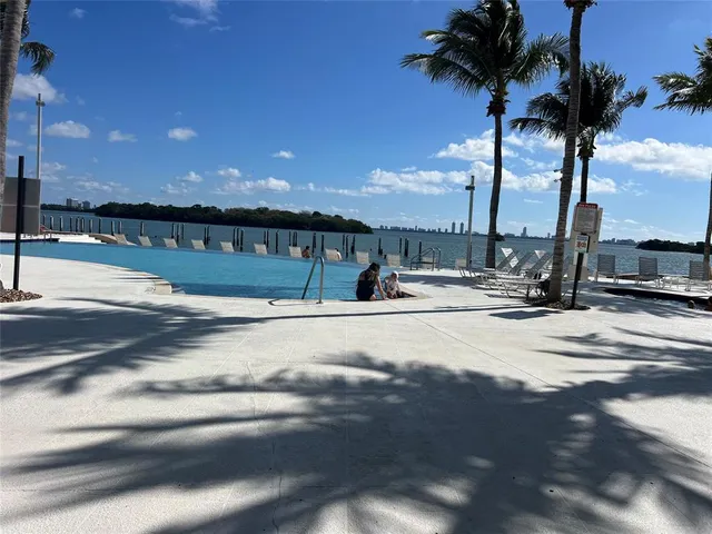 a view of a swimming pool and an outdoor space