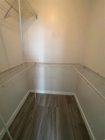 a bathroom with a double vanity sink and mirror