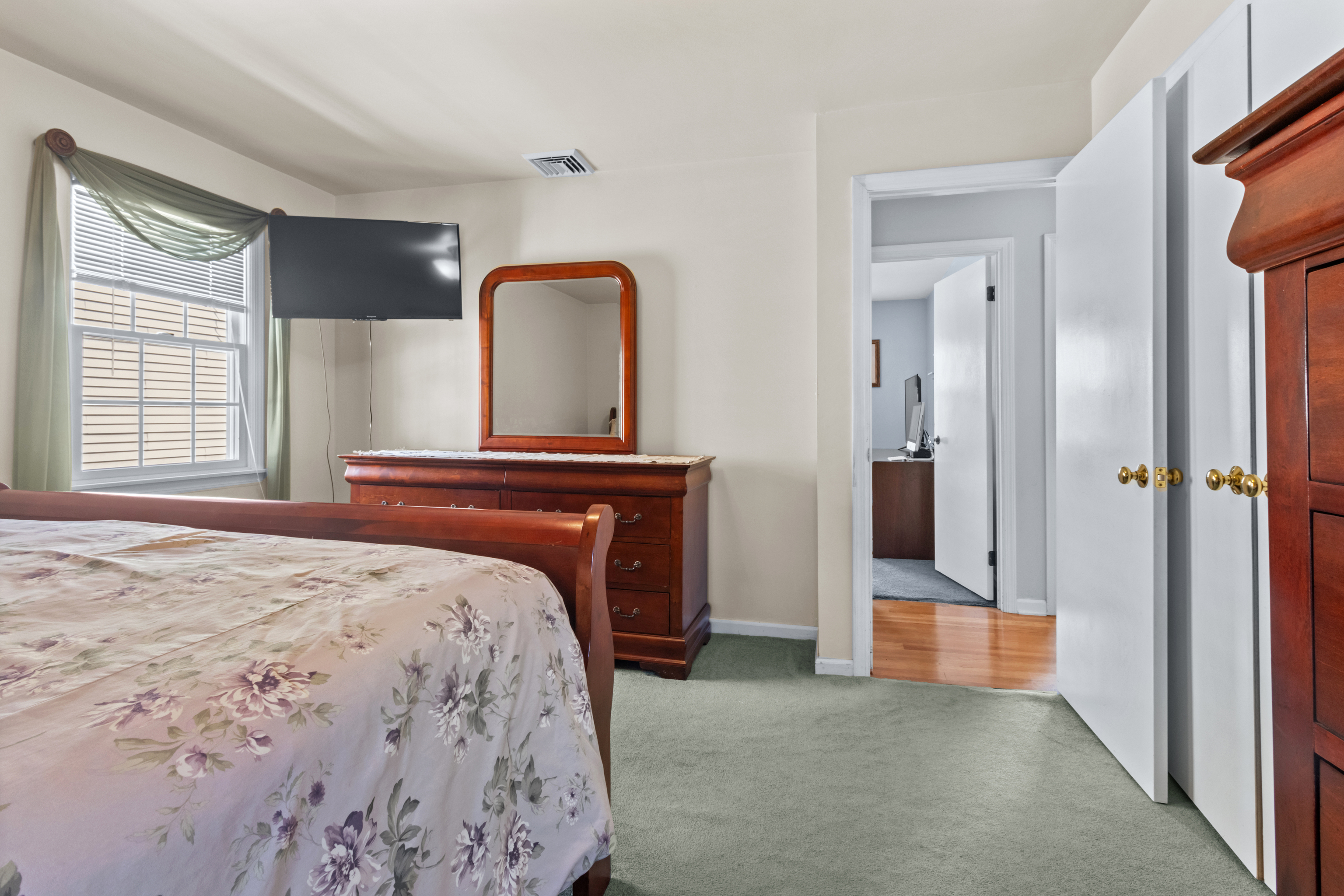 16 Katy Lane Norwalk, CT 06851 - Photo 14 of 31 a bedroom with a bed and a mirror