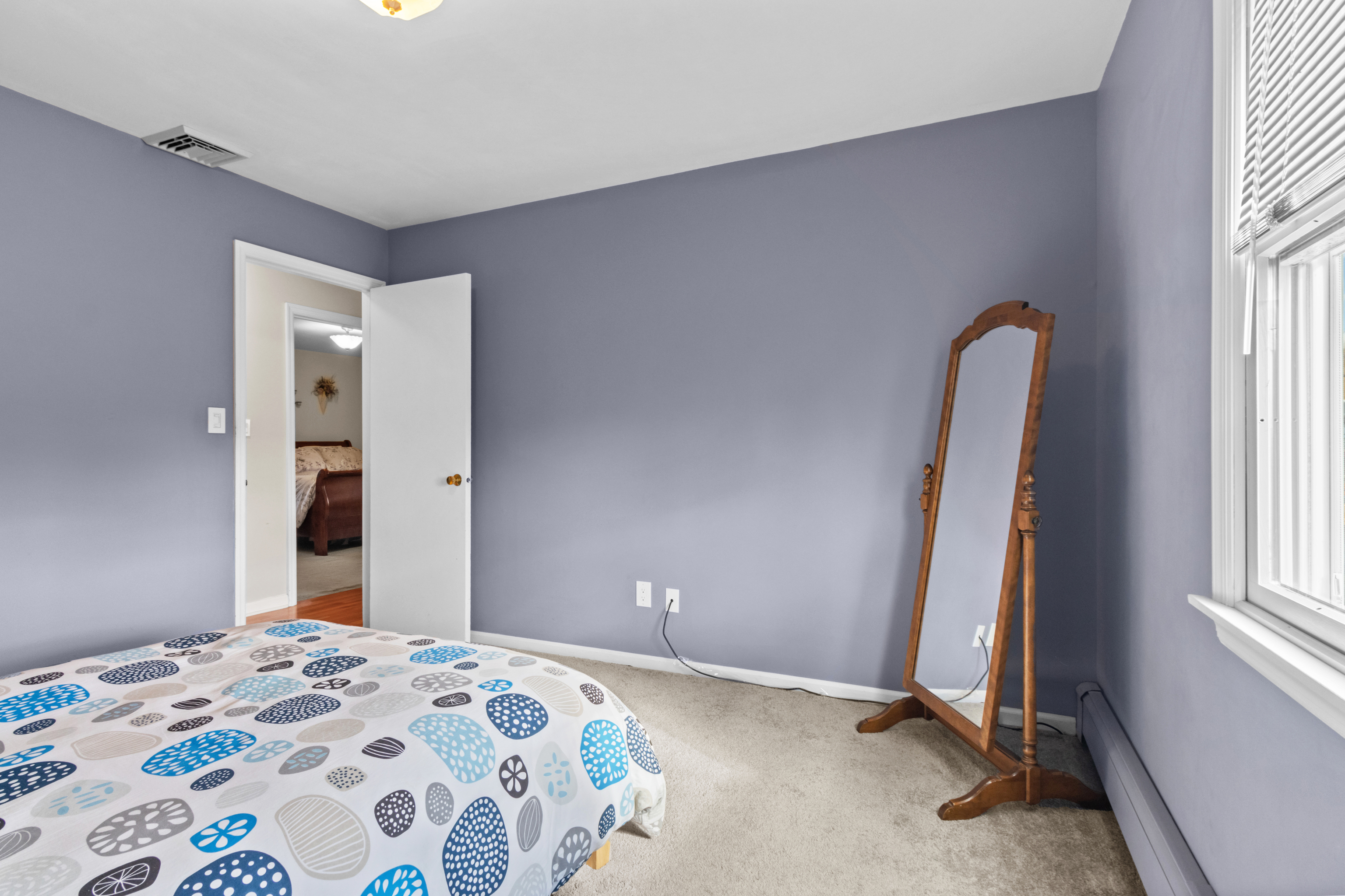 16 Katy Lane Norwalk, CT 06851 - Photo 16 of 31 a bedroom with a bed and a window