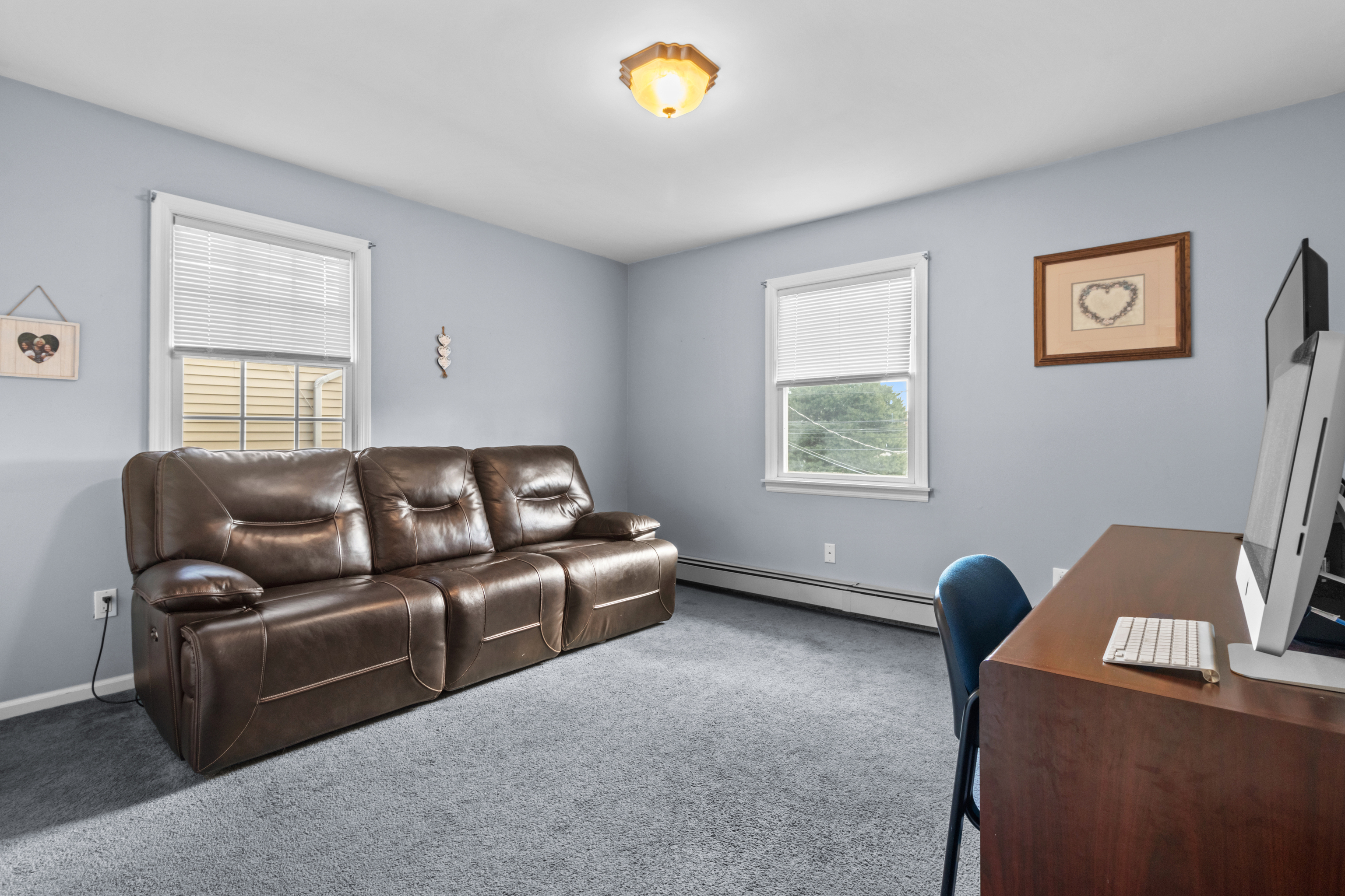 16 Katy Lane Norwalk, CT 06851 - Photo 17 of 31 a living room with furniture and a window