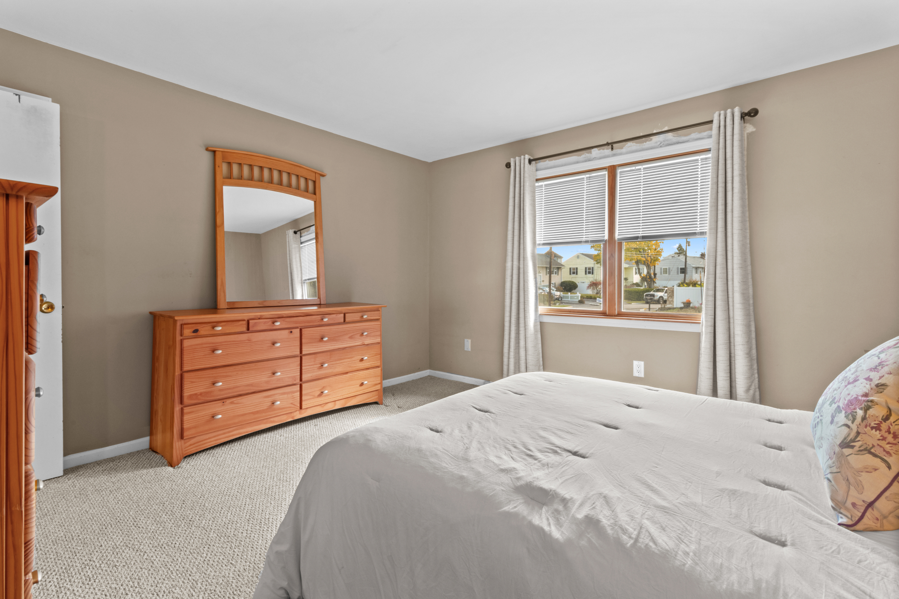 16 Katy Lane Norwalk, CT 06851 - Photo 20 of 31 a bedroom with a bed and a dresser in it