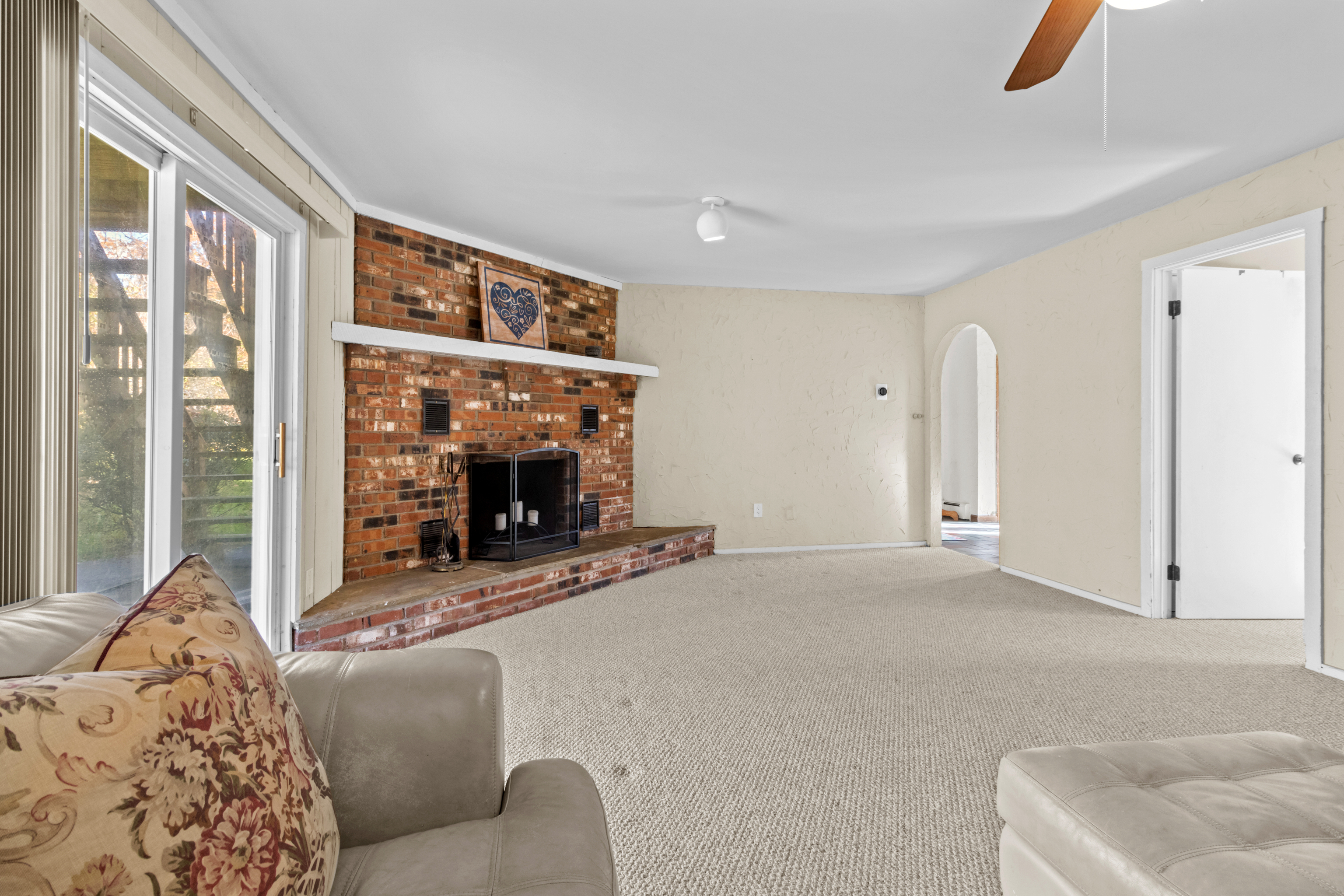 16 Katy Lane Norwalk, CT 06851 - Photo 21 of 31 a living room with furniture a window and a fireplace