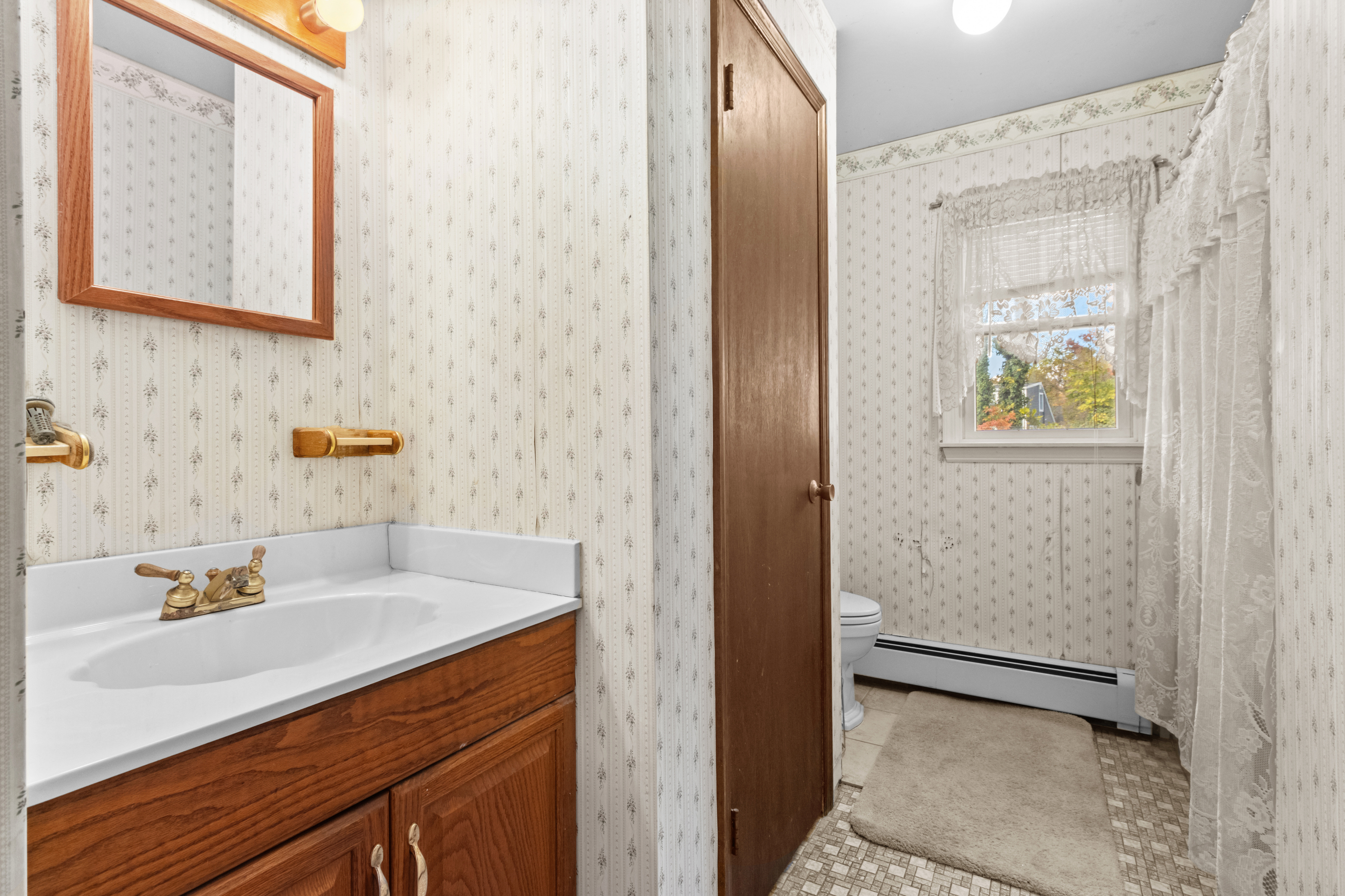 16 Katy Lane Norwalk, CT 06851 - Photo 24 of 31 a bathroom with a sink and a mirror