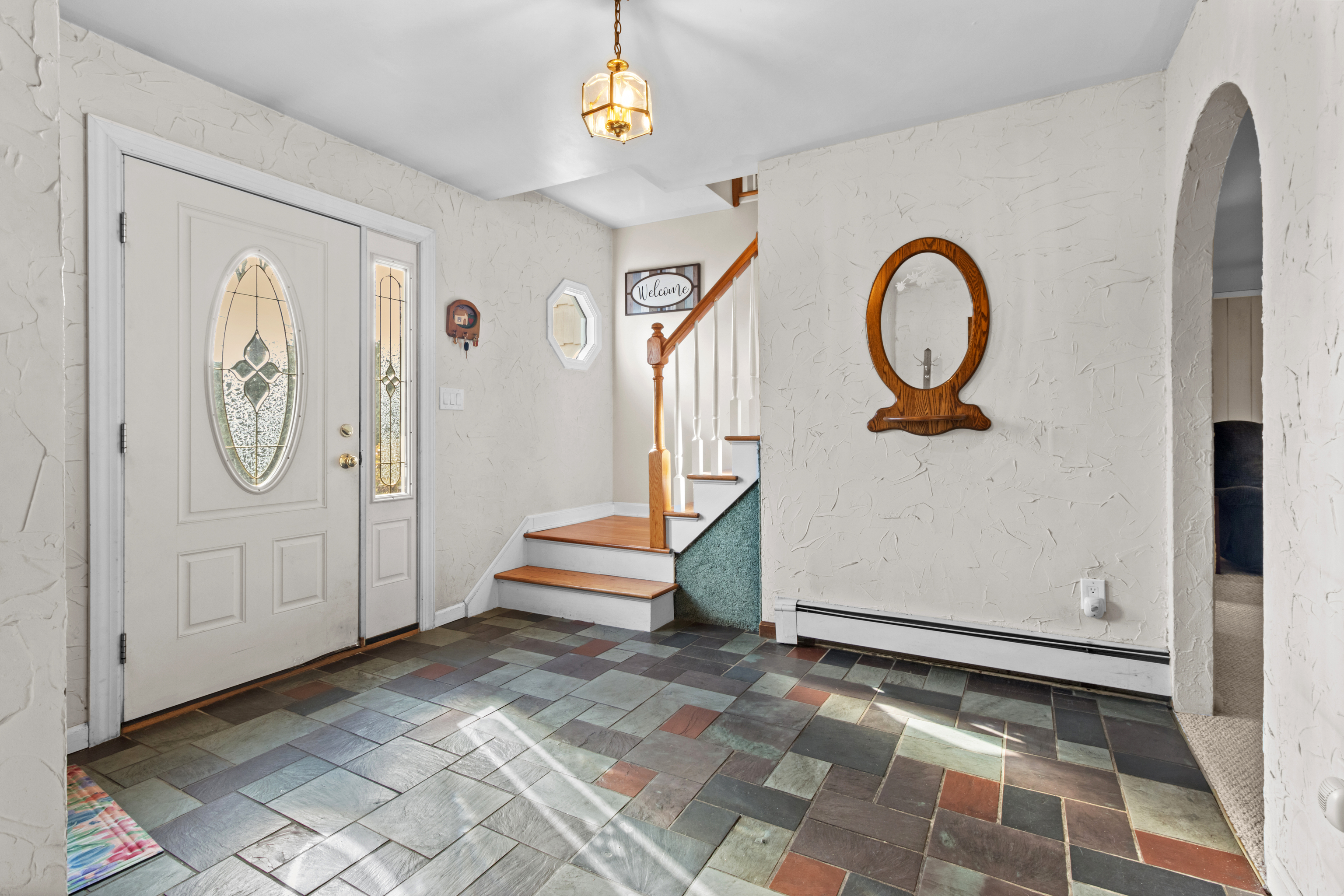 16 Katy Lane Norwalk, CT 06851 - Photo 28 of 31 a view of a hallway with entryway wooden floor and front door