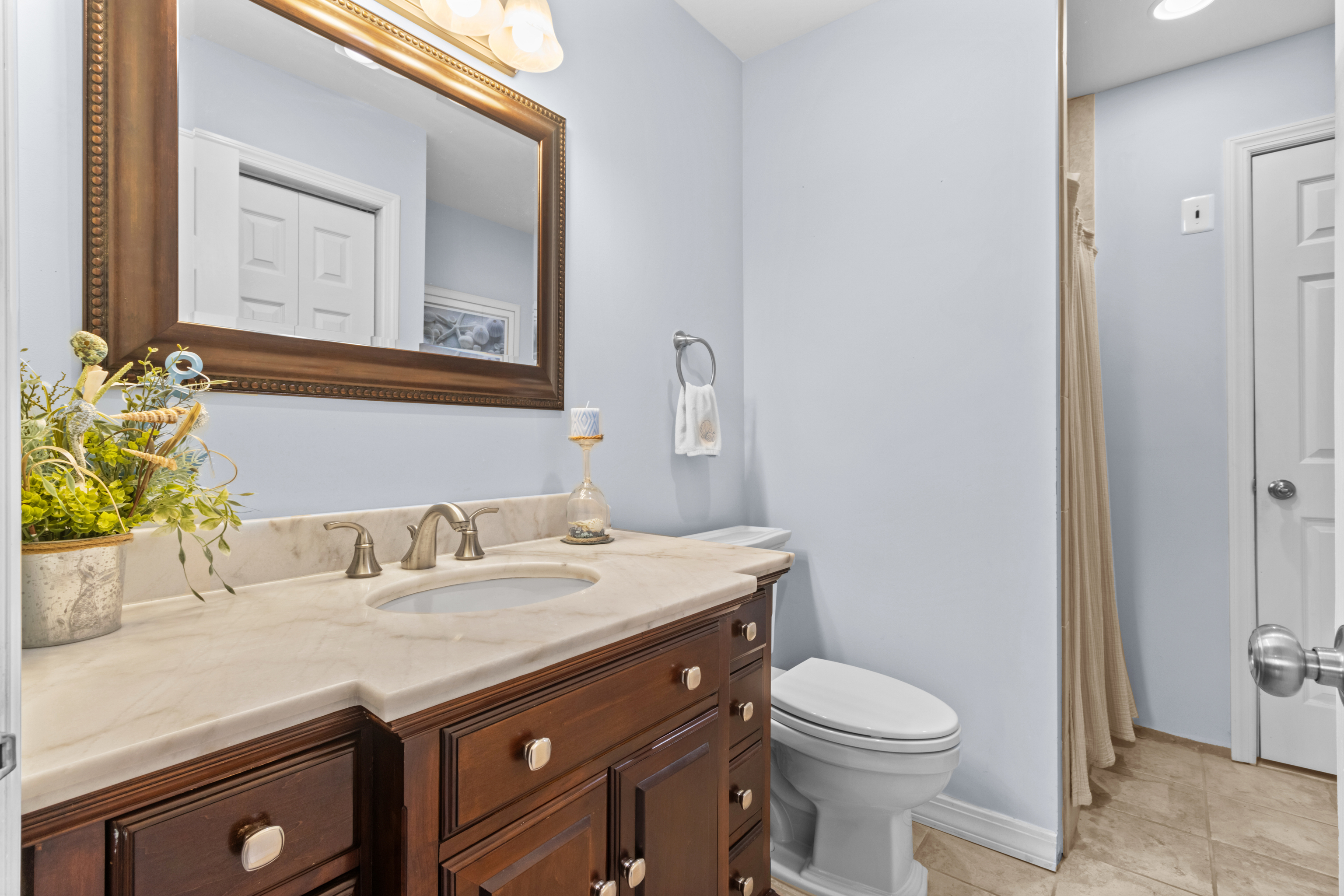 16 Katy Lane Norwalk, CT 06851 - Photo 10 of 31 a bathroom with a granite countertop toilet sink and mirror