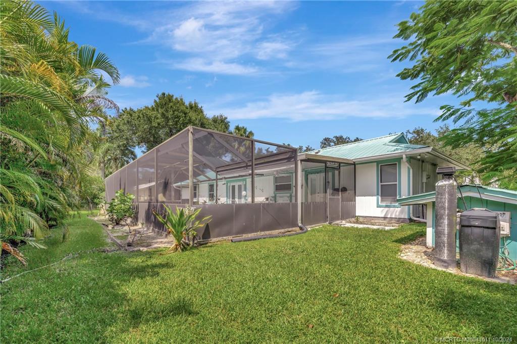 6806 Southwest Chase Court Stuart, FL 34997 - Photo 27 of 37 Backyard towards the Home