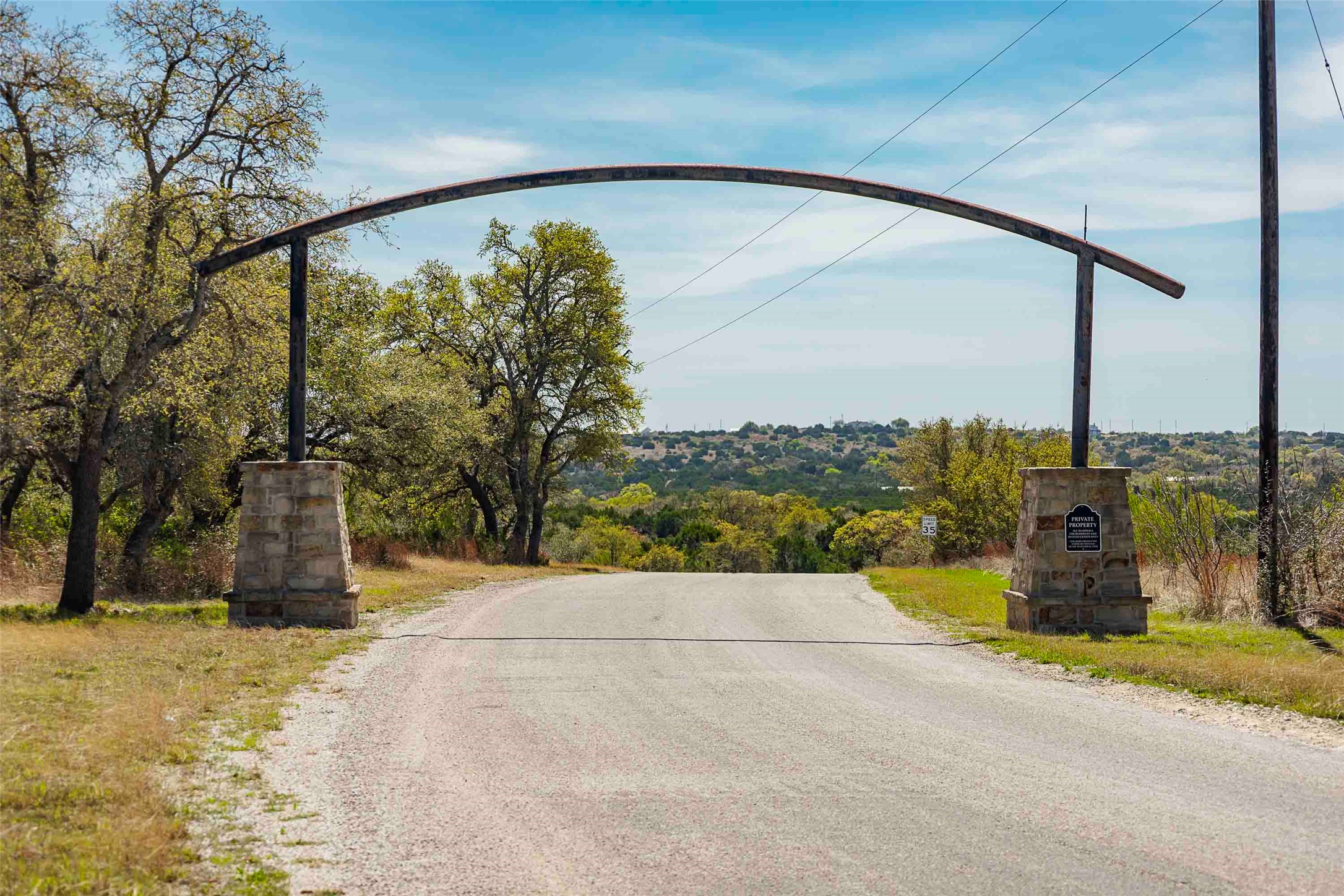 Tbd Saddle Ridge Drive Bertram, TX 78605 - Photo 2 of 40 a view of a street with a building in the background