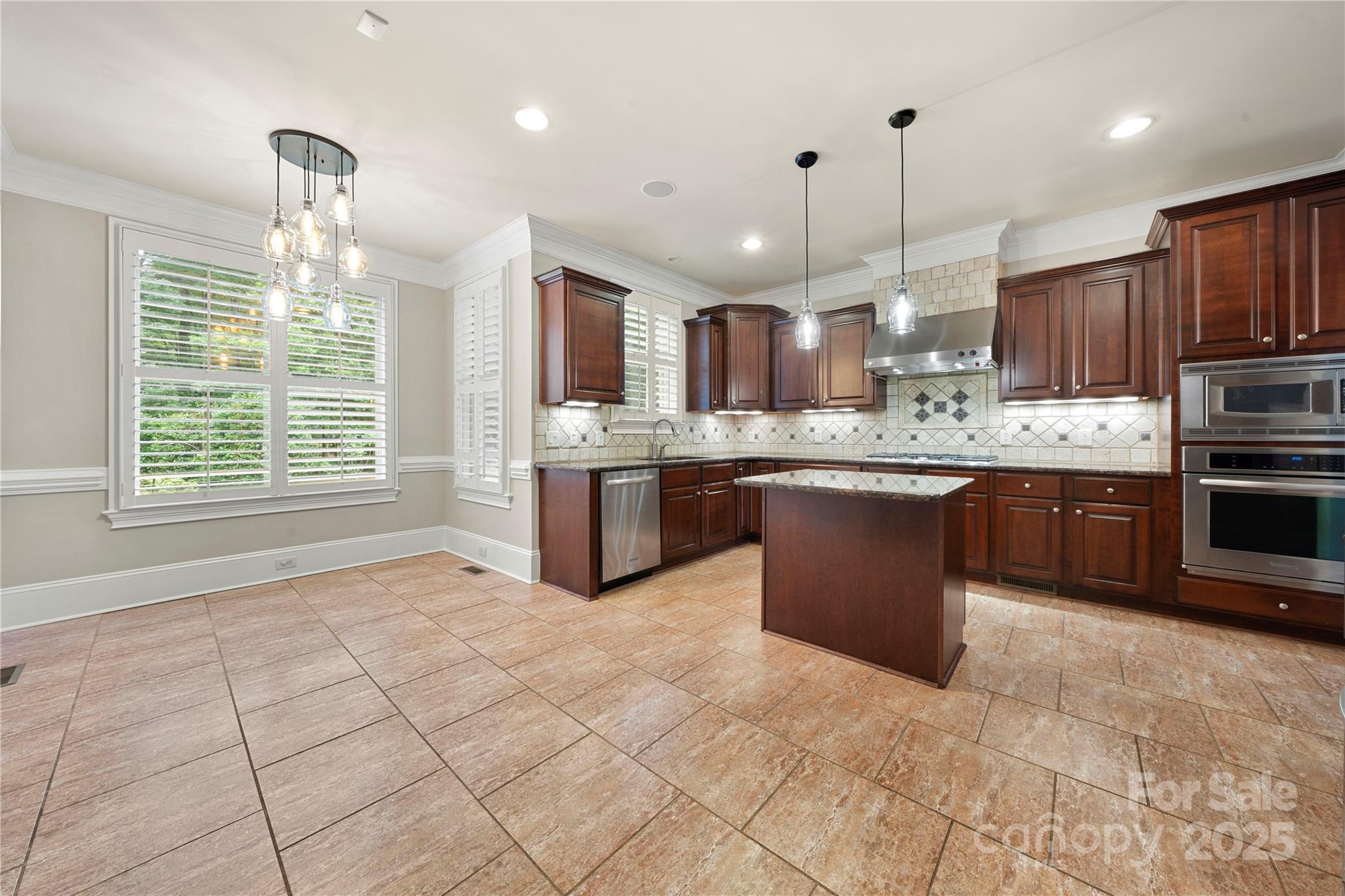 310 Ridge Reserve Drive Clover, SC 29710 - Photo 14 of 39 a large kitchen with kitchen island a large counter top stainless steel appliances and cabinets