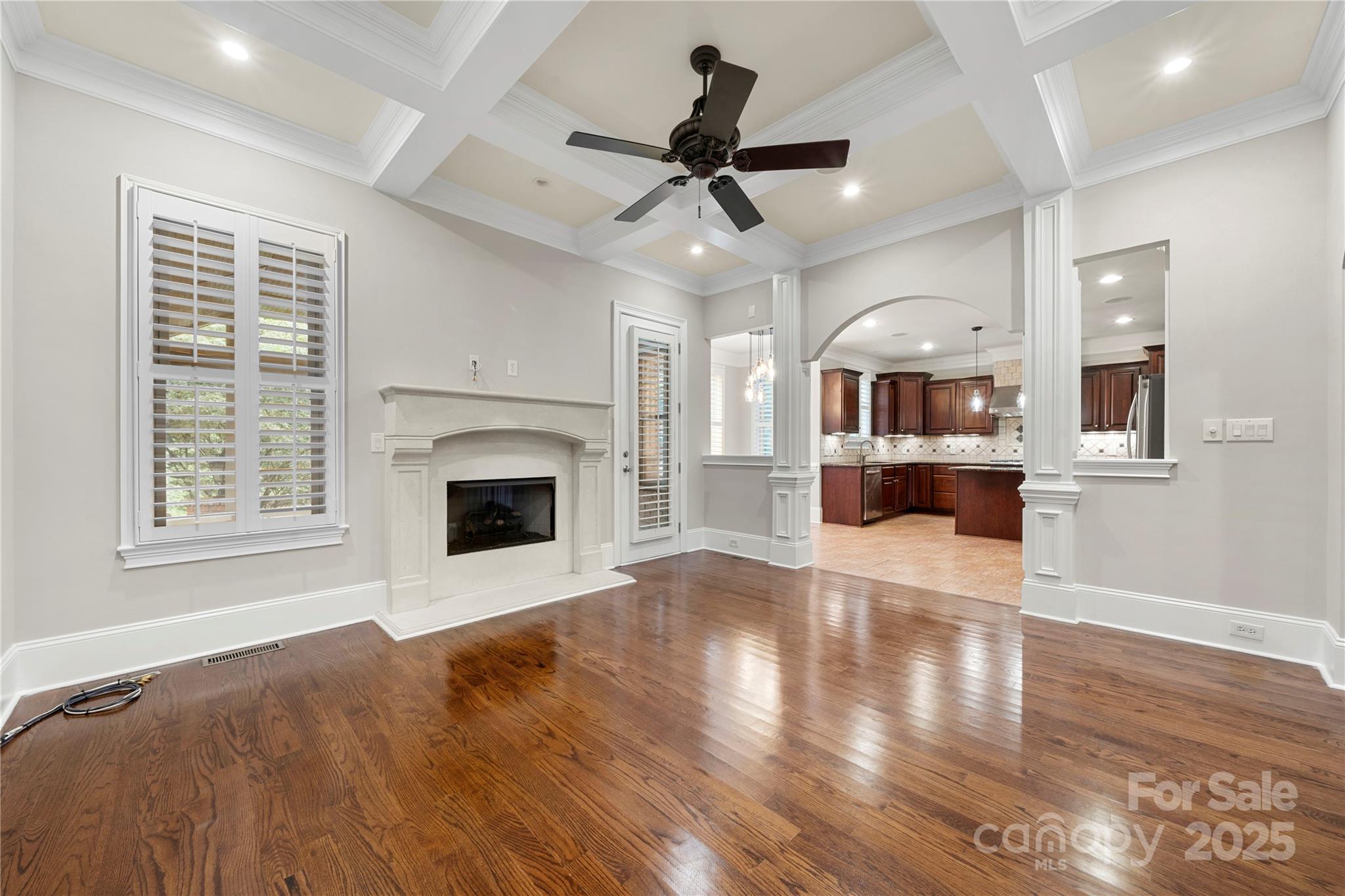 310 Ridge Reserve Drive Clover, SC 29710 - Photo 16 of 39 a view of a livingroom with a fireplace a ceiling fan and wooden floor