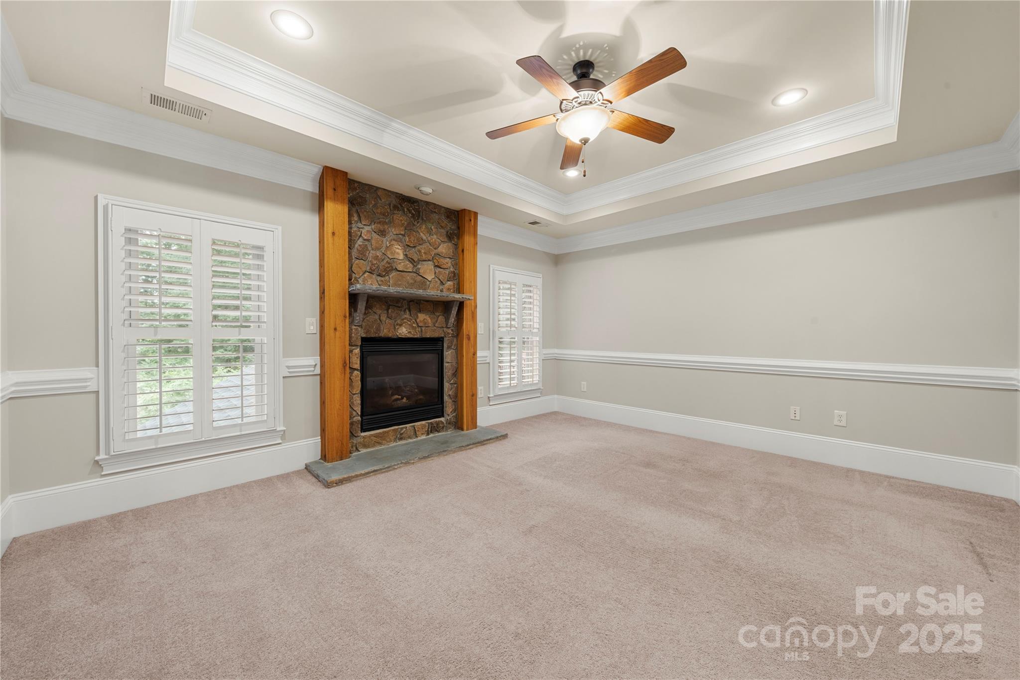 310 Ridge Reserve Drive Clover, SC 29710 - Photo 25 of 39 an empty room with a fireplace and a ceiling fan