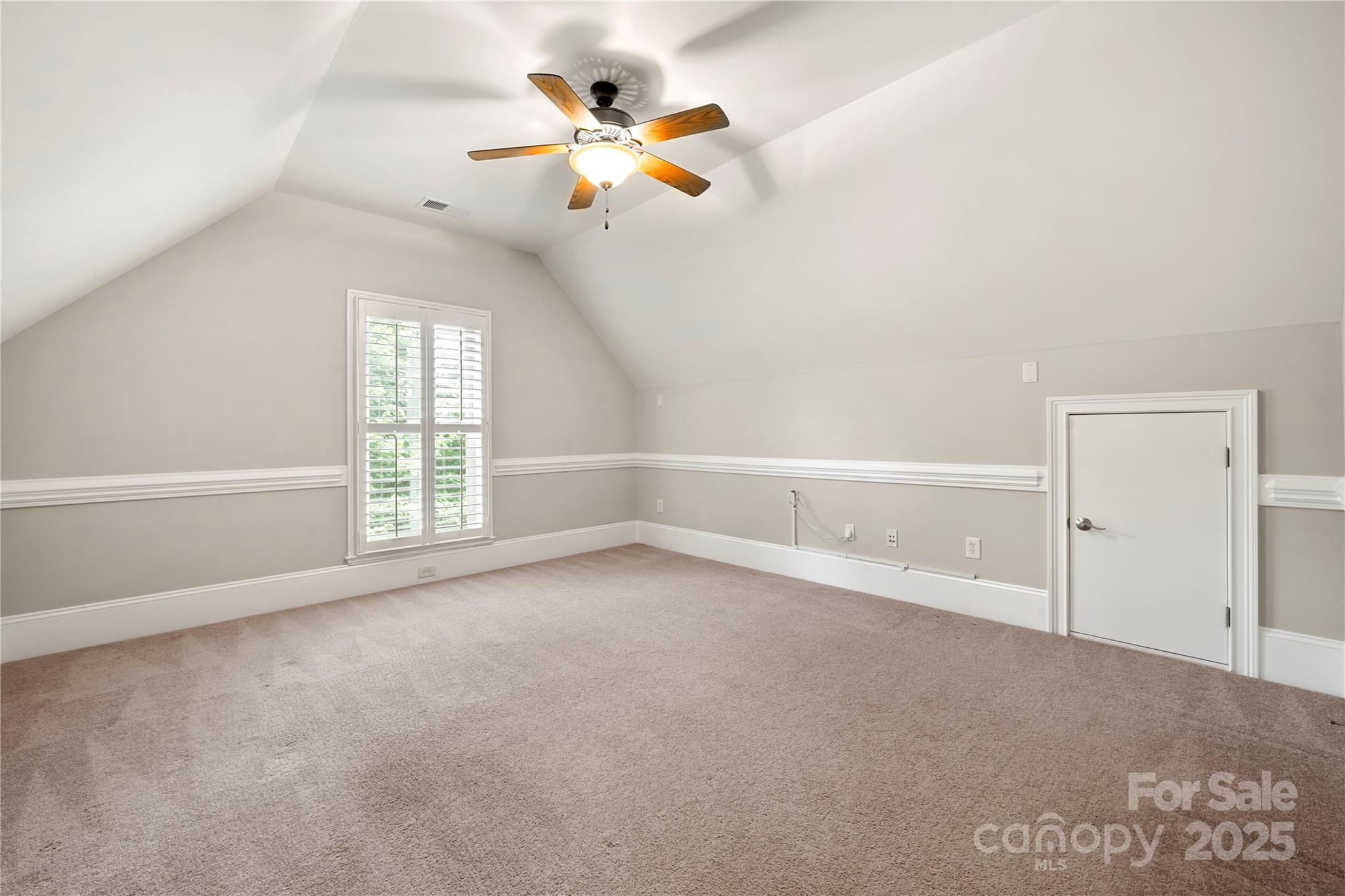 310 Ridge Reserve Drive Clover, SC 29710 - Photo 34 of 39 an empty room with chandelier fan and windows