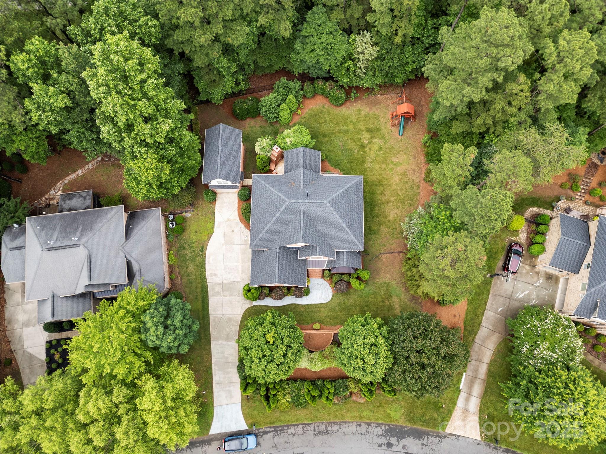310 Ridge Reserve Drive Clover, SC 29710 - Photo 5 of 39 an aerial view of a house with a yard and garden