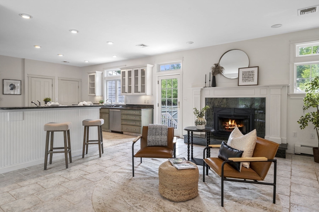 209 Maple Street Danvers, MA 01923 - Photo 13 of 42 a living room with furniture and a fireplace