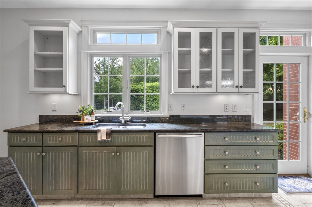 209 Maple Street Danvers, MA 01923 - Photo 16 of 42 a kitchen with a sink and cabinets