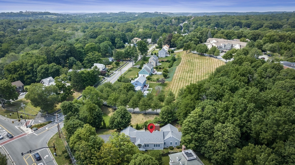 209 Maple Street Danvers, MA 01923 - Photo 2 of 42 an aerial view of residential house with outdoor space and trees all around