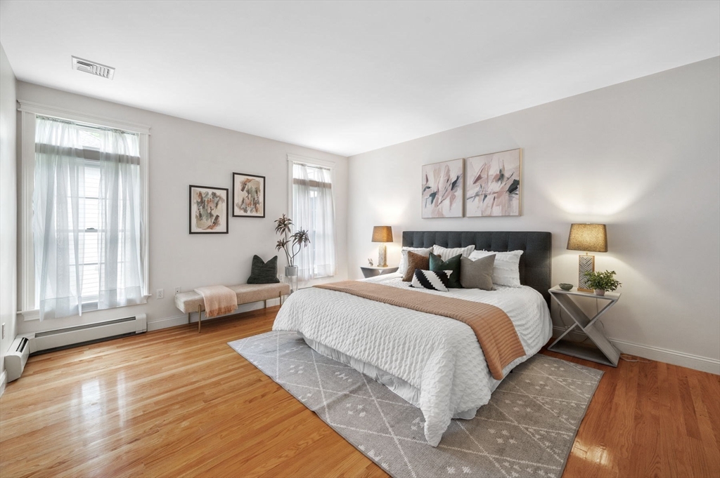 209 Maple Street Danvers, MA 01923 - Photo 24 of 42 a spacious bedroom with a bed and a large window