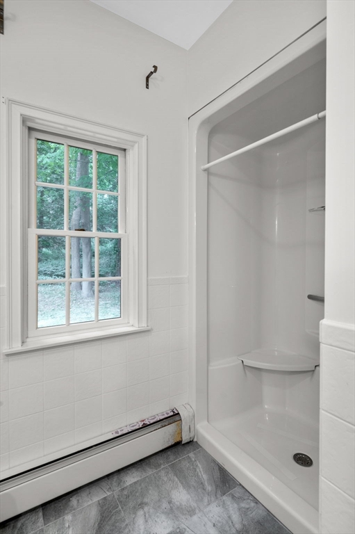 209 Maple Street Danvers, MA 01923 - Photo 28 of 42 a view of an empty room with a window