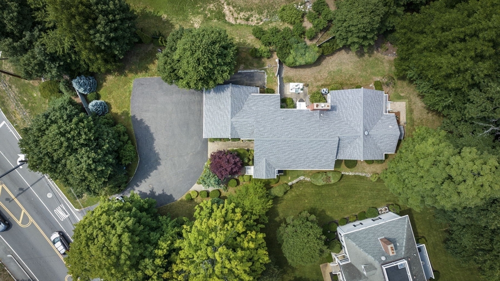 209 Maple Street Danvers, MA 01923 - Photo 3 of 42 an aerial view of a house with a yard