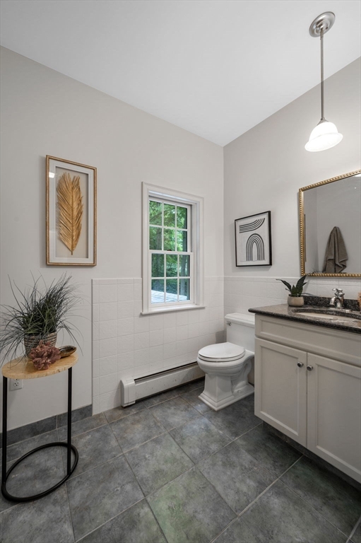 209 Maple Street Danvers, MA 01923 - Photo 31 of 42 a living room with a sink furniture and a window