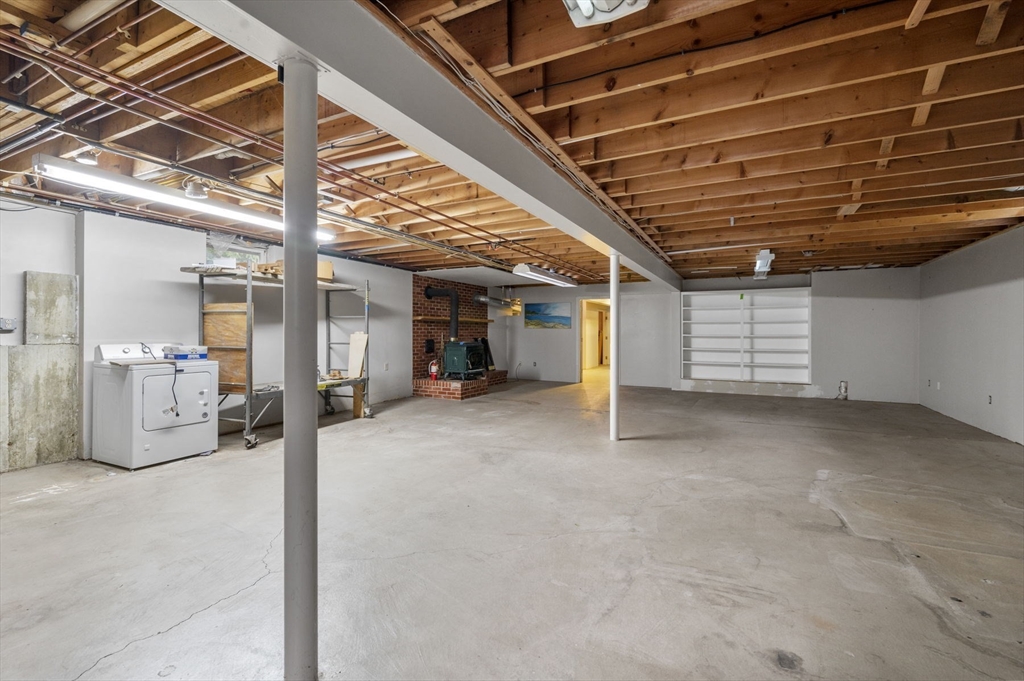 209 Maple Street Danvers, MA 01923 - Photo 34 of 42 a view of empty room with wooden ceiling