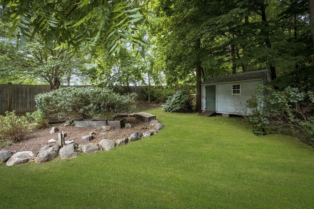 209 Maple Street Danvers, MA 01923 - Photo 41 of 42 a view of backyard with plants and trees