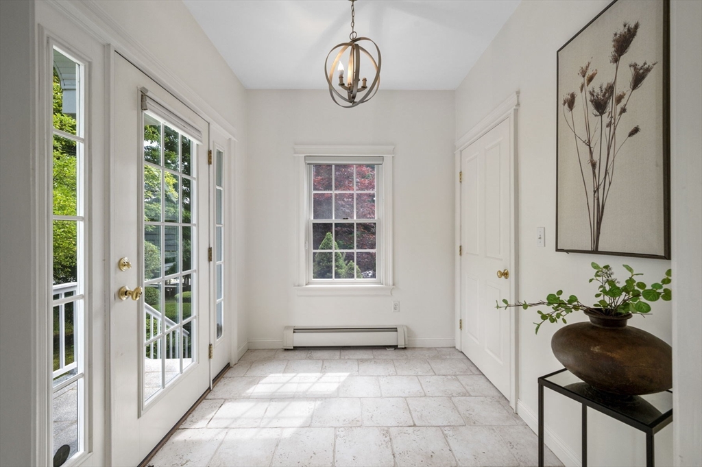 209 Maple Street Danvers, MA 01923 - Photo 8 of 42 a view of an entryway with wooden floor