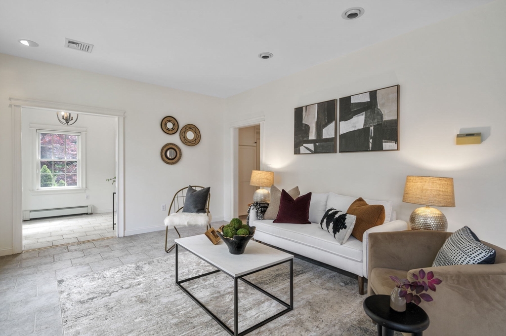 209 Maple Street Danvers, MA 01923 - Photo 9 of 42 a living room with furniture and wooden floor