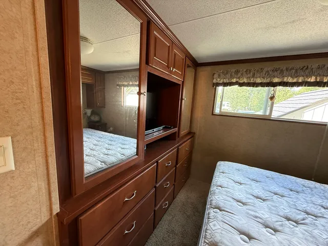 a view of bedroom with wooden floor