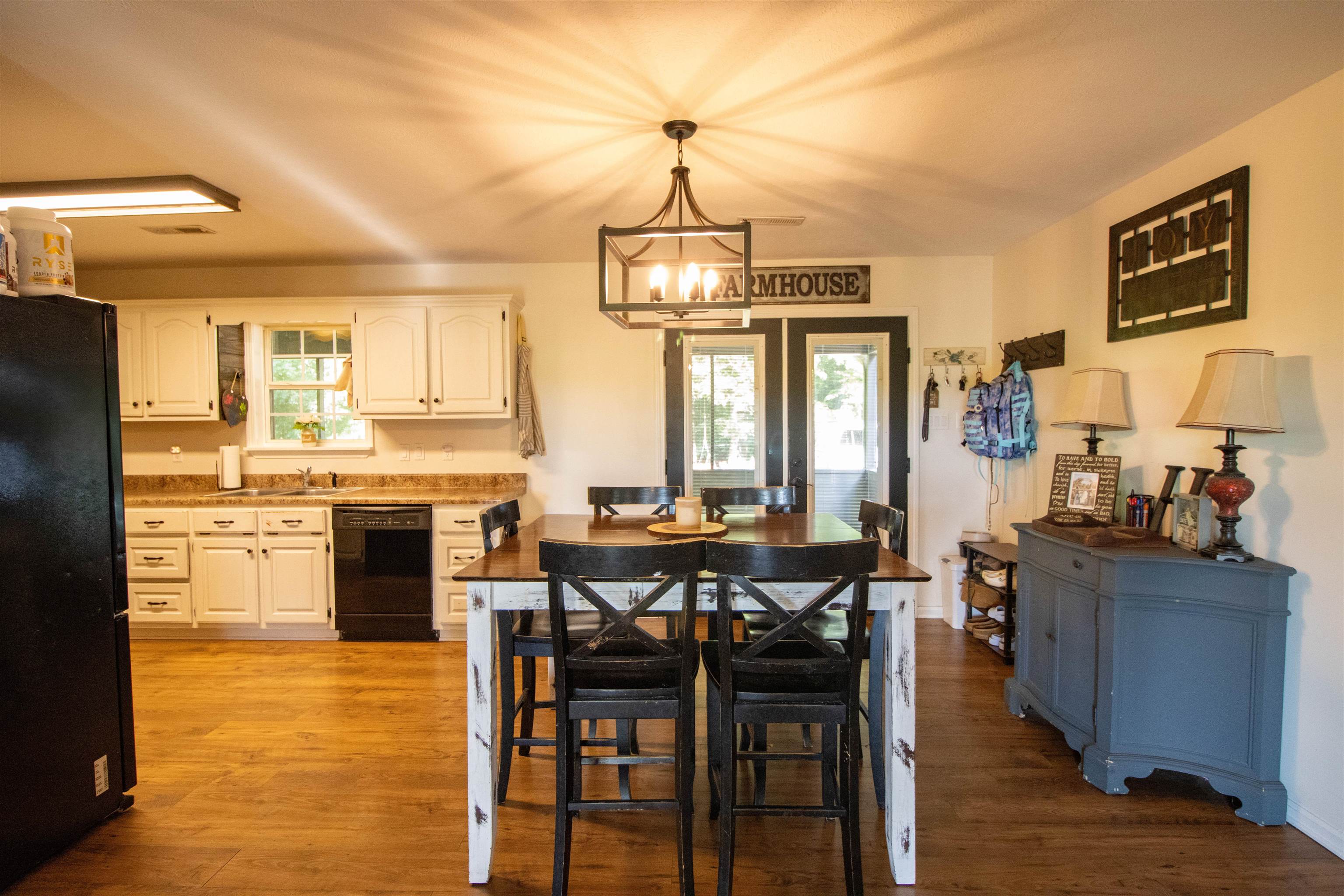 120 Craig Road Ripley, TN 38063 - Photo 11 of 38 Open-concept dining and kitchen area featuring wood-finish flooring